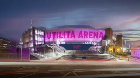 Utilita Arena A dimly lit in pink lighting dome building known as the Utlilita Arena