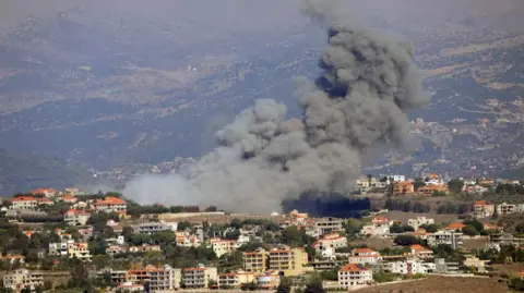 Reuters Smoke billows over Khiam, Lebanon 