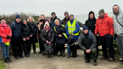 Fiona Taylor-Dane Team of volunteers all dressed up warmly and in waterproofs.