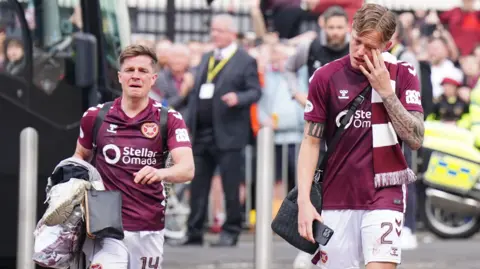 Hearts players arrive back at Tynecastle