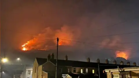 Wildfire at night above Cwmavon