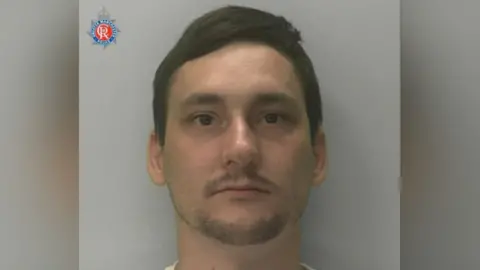 GMP Dale Austin has short dark hair and slight goatee beard