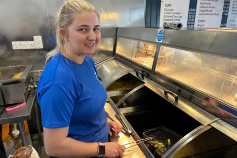 Sioned Phillips working behind the friers at Cegin-24 in Crymych