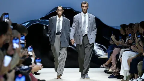 Getty Images Man and Woman in Armani Suits