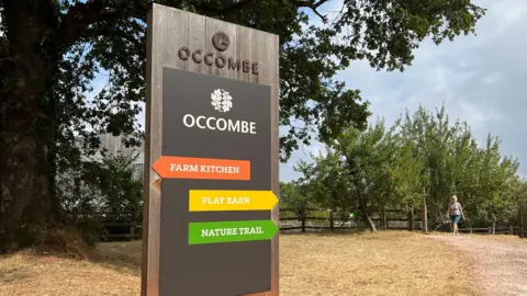 An Occombe farm sign outside the visitor site.