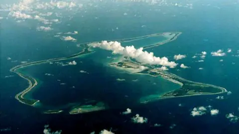 Pictures of Reuters Diego Garcia, the largest island in the Shaghus Archipelago, are surrounded by water