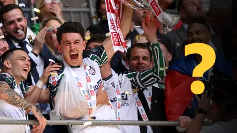 Sunderland players lift the Championship play-off final trophy in 2025