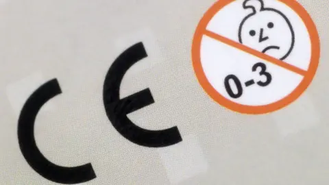 Getty Images A CE safety mark on a toy next to an age restriction symbol.