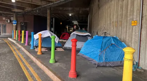 Three tents at a city centre car park