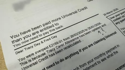 George King/BBC A close-up of a letter from Universal Credit addressed to Tracy and Fred Day