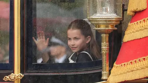 PA Media Princess Charlotte places her hand against window of steamed-up carriage