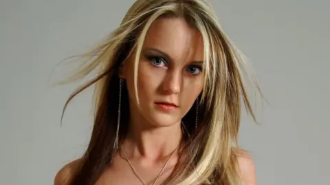 Metropolitan Police Sally Anne Bowman, a young woman with long blond hair, looks at the camera in a styled shot