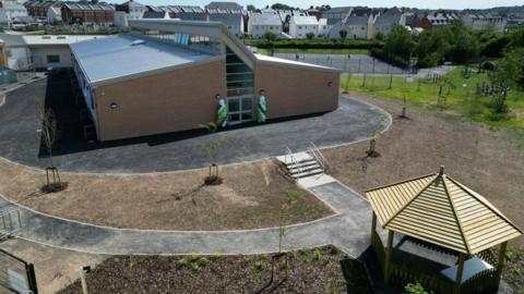 An aerial photo of the new extension at the school, with the playground and a gazebo also visible