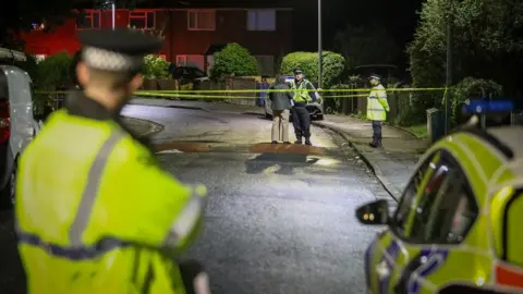 Police at Aspinall Crescent in Salford