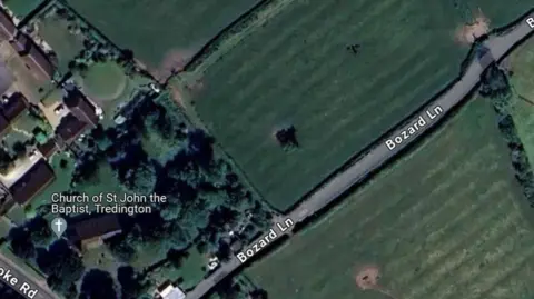 Google Aerial view of land around the church
