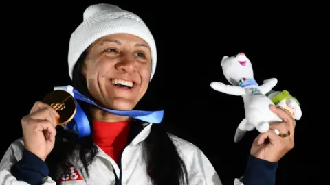 Elana Meyers Taylor celebrates with gold medal at Winter Olympics in Cortina 2026