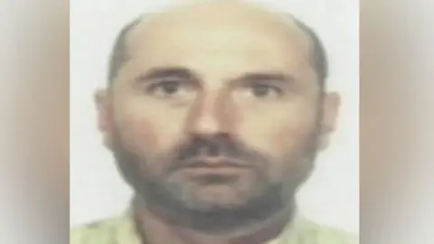 BBC James Hurley has a shaved head and a stubble, appearing in his police custody photo.