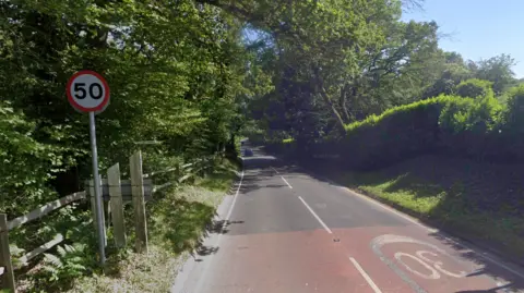A screen grab of a country road. 