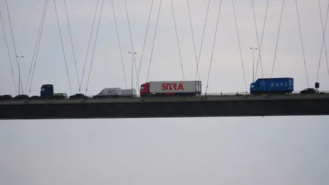 Joe Bilton / BBC Lorries and other vehicles stuck on the middle of the Humber Bridge 