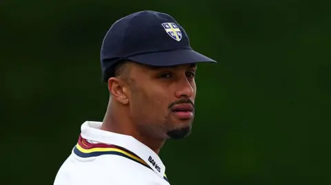 Durham's Emilio Gay looks on in the field against Kent in the County Championship.