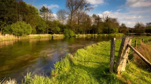 A stretch of the chalkstream river Itchen near Twyford, Hampshire, popular for trout fishing - stock photo