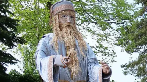 Richard Hawkins/PA Media A scarecrow of Professor Albus Dumbledore from Harry Potter