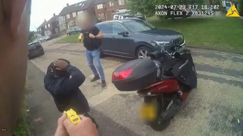 Kent Police/PA Wire Screen grab taken from bodyworn video dated 23 July 2024, issued by Kent Police, shows the arrest of Anthony Esan. Footage has been shown in court of the moment Esan was arrested outside his home.