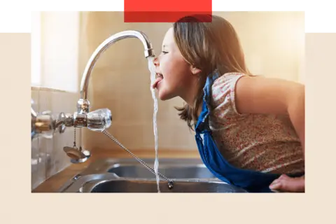 Getty A photo of a girl drinking water from a running tap