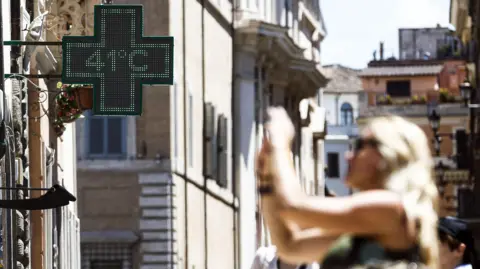 EPA People take shelter from heat during a heatwave, in Rome, Italy, 28