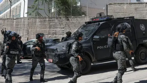 AFP Israeli security forces deploy outside an Unrwa school in Shuafat refugee camp in Israeli-annexed East Jerusalem (8 May 2025)