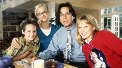 Alamy Jake Thomas, Hallie Todd, Robert Carradine and Hilary Duff pictured in the Disney Channel series Lizzie McGuire