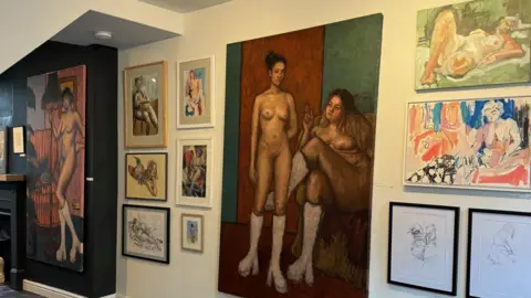 Val Harris Gallery wall featuring both canvas and framed life drawings of men and women. 