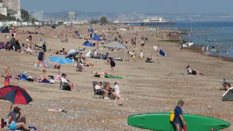 Eddie Mitchell A busy beach on a very sunny evening