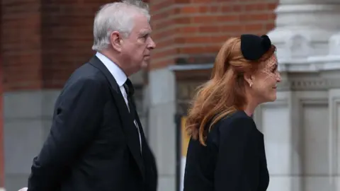 EPA Andrew Mountbatten-Windsor and Sarah Ferguson going into a church