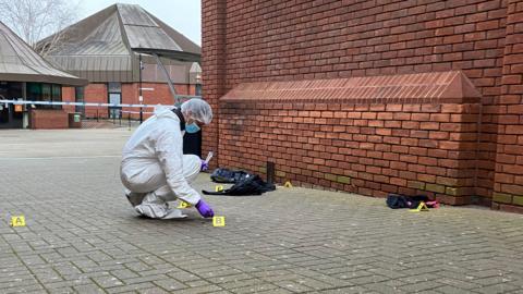 Forensic officers working at the scene