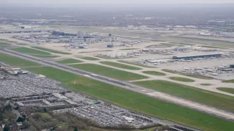 PA Media An aerial view of an empty runway at Heathrow Airport. 