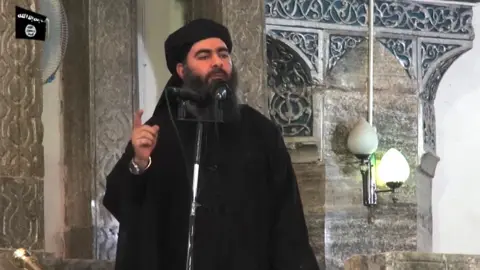 AFP  Abu Bakr al-Baghdadi with a long beard and black robes speaking at the Great Mosque of al-Nuri in Mosul, July 2014