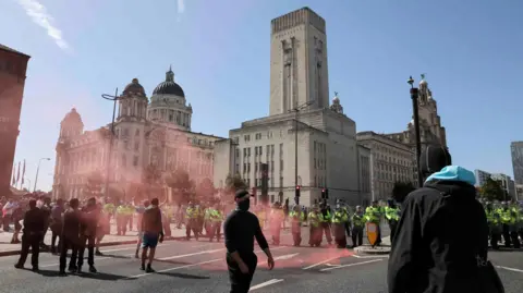 Reuters Protestors clash with police in Liverpool city centre