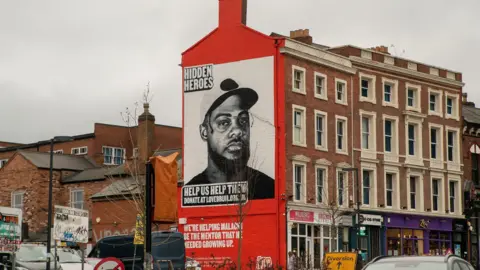 LoveBrum Wide shot of a street art depiction of Malachi Nunes