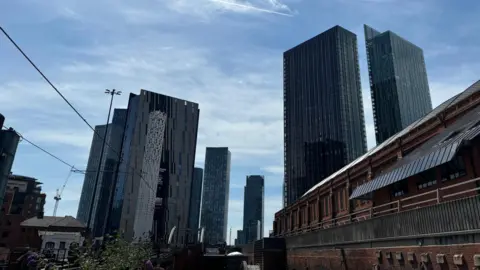 BBC/Rachael Lazaro Manchester's high rise buildings tower over the city centre