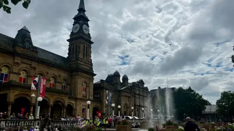 Anna Jameson/BBC People gathered outside Souhtport Town Hall