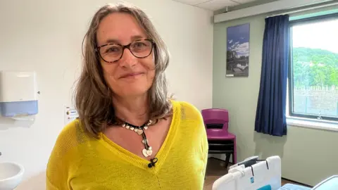 Julie Mackie in a hospital room