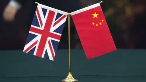 Reuters The union flag and the flag of the People's republic of China