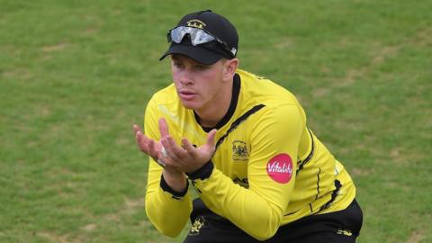 Ben Wells ready to make a catch, playing for Gloucestershire