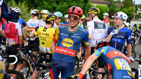  Mads Pedersen of Denmark and Team Lidl - Trek and the peloton waiting after the neutralization of the race
