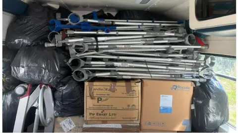 Rotary Club of Northampton Becket Interior of ambulance showing folded-up walking frames and boxes