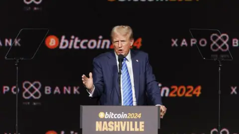 Getty Images Trump speaks at a Bitcoin conference in Nashville in July.