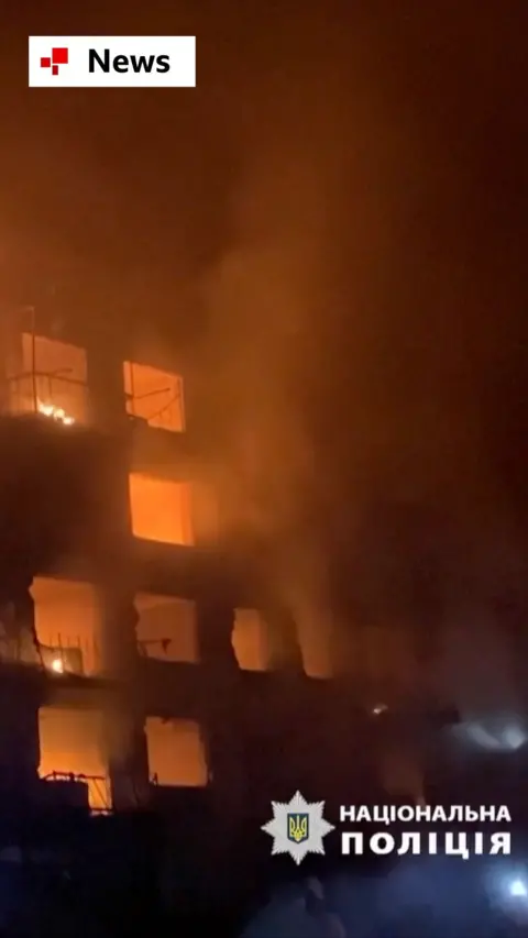 A building is engulfed in flames after a Russian strike