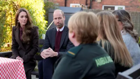 Reuters The Prince and Princess of Wales speaking to emergency responders who helped at the scene of the knife attack in Southport