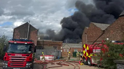 Nottinghamshire Fire and Rescue Service Fire engines at the scene of a blaze